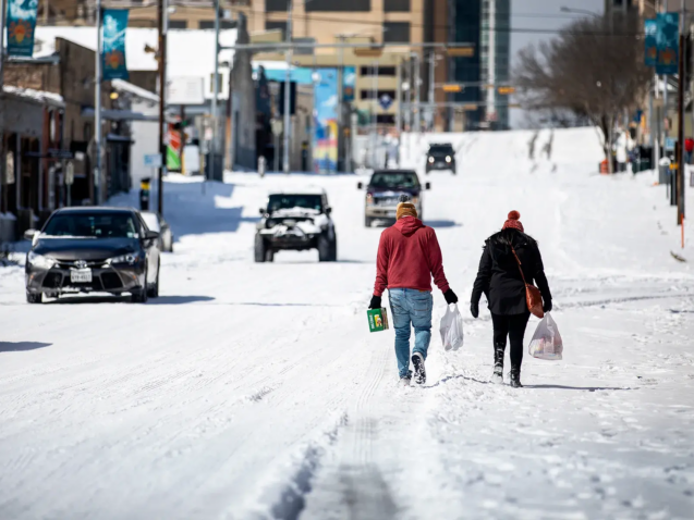 Icy Texas roadway with residents walking as LDR Site Services restores grocery operations.