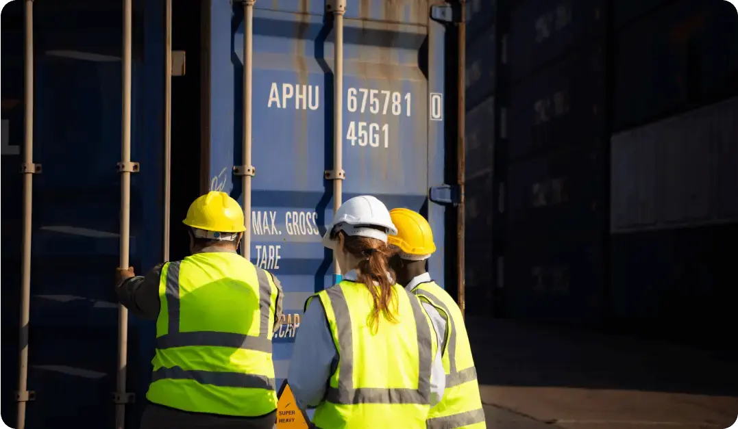 LDR Site Services safety team inspecting shipping container during contamination cleanup operations.