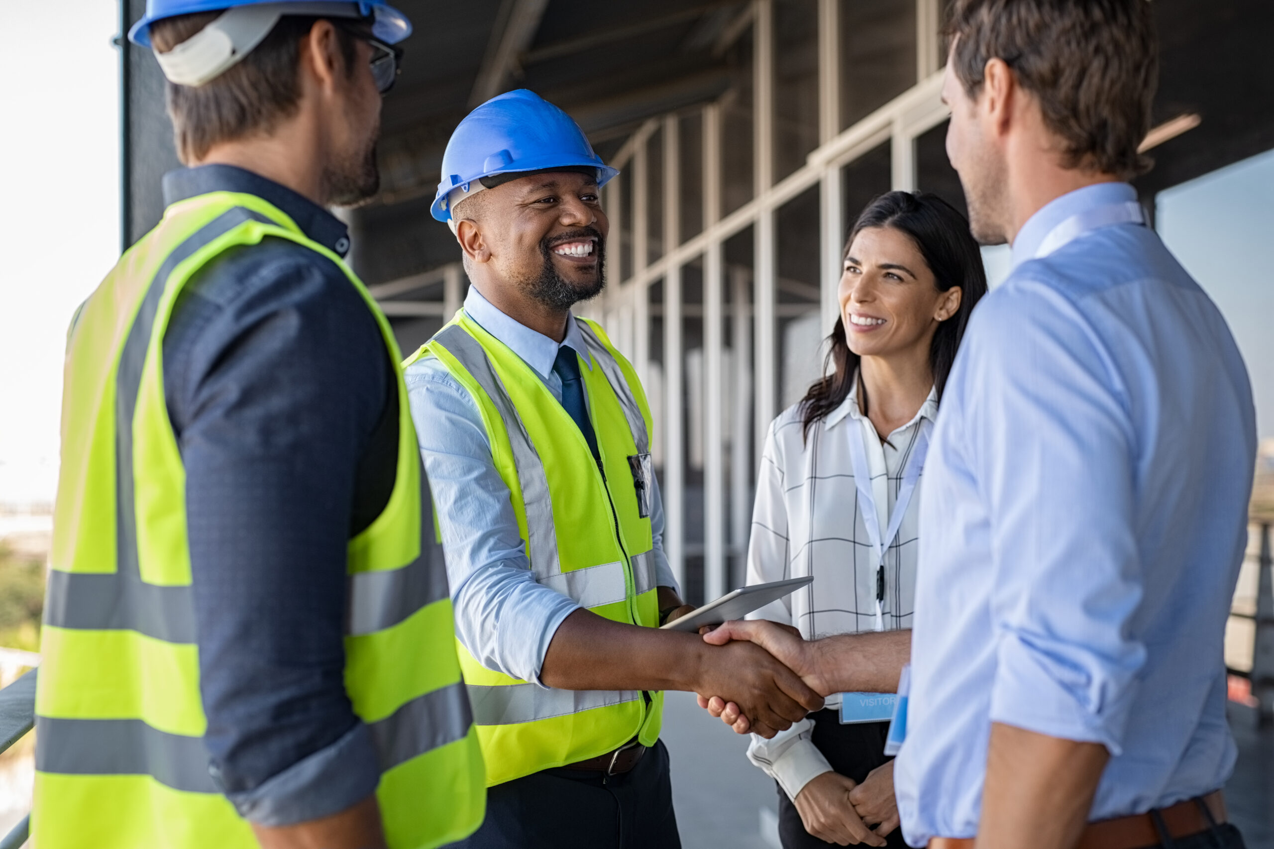 Construction manager reviewing plans on a large jobsite