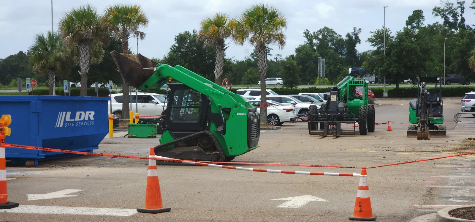 LDR Site Services equipment staged at a retail parking lot construction project
